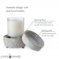 candle sits on base with tray to the side