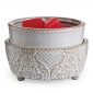 melts on vintage white warmer with white background