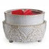 melts on vintage white warmer with white background