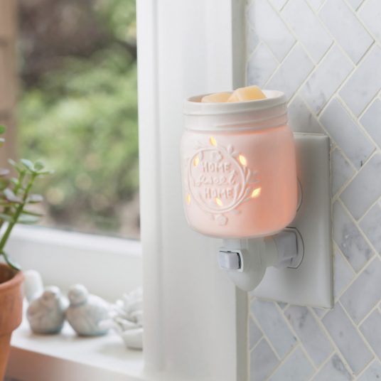 white warmer plugged near kitchen window