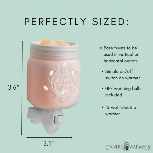 warmer is shown as 3.6&quot; tall, and 3.1&quot; wide Warmer with green background 