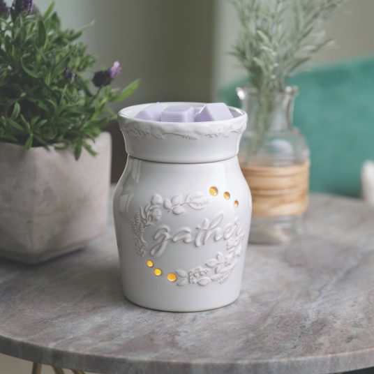 white &quot;gather&quot; warmer sits on table.