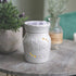 white "gather" warmer sits on table.