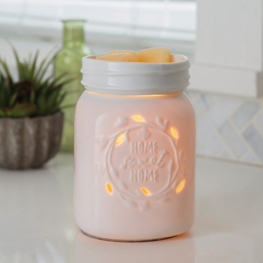 Home sweet home white warmer with melts sit on a white kitchen counter