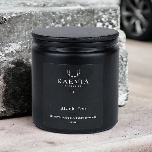 Red Stag 12 point candle eco-friendly, handcrafted soy blend candle in a black jar with a blak lid against a concrete background