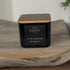 Kaevia Red Stag Trophy candle in a minimalist black jar with a natural lid on a tray