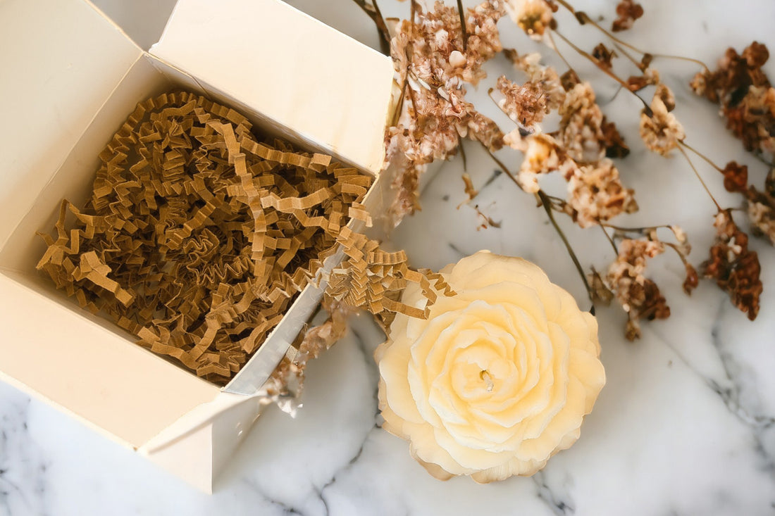 Flower Shaped candle near gift box
